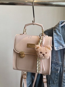 Pink PU leather fashion backpack with bear pendant and gold metal buckle detail