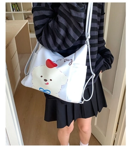 Détail du sac blanc avec illustration de chien mignon et poche latérale pratique