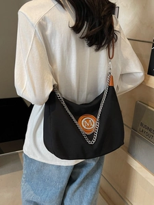 Large capacity black nylon crossbody bag with silver M logo and metal chain strap