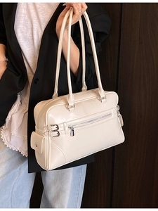 Vintage beige Boston bag with double straps and front zipper detail for daily commute