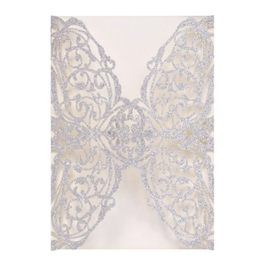 Elegant silver glitter laser cut wedding invitation with symmetrical cutout floral pattern