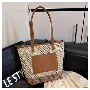 Detail of two-tone woven tote bag with brown PU leather straps and decorative pocket