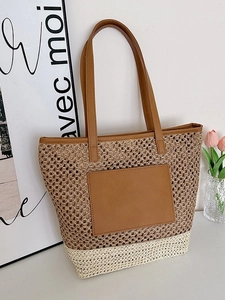 Large summer woven straw tote bag with brown leather handles and color-block design