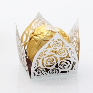 Detailed laser-cut white paper lace wrapper with elegant hollow rose flower patterns