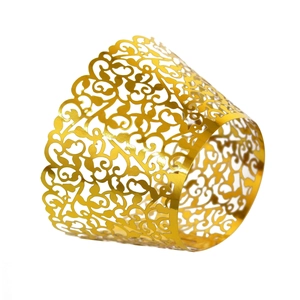 Golden laser cut cupcake wrappers with elegant vine patterns for wedding party decor