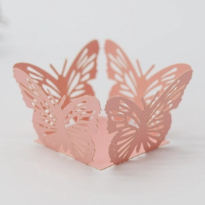 Detailed laser-cut pink butterfly paper ring for cupcake decoration and wedding favors