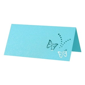 Macro view of blue pearlescent paper table card with laser-cut butterfly detail