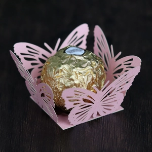 Detailed laser-cut pink butterfly chocolate wrapper holder for wedding party favors