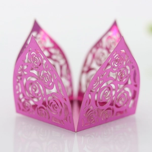 Detail view of laser-cut rose hollow pattern in rose pink on metallic decorative paper