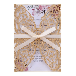 Elegant laser cut butterfly wedding invitation with gold glitter cover and ribbon bow