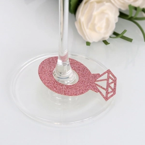 Detail of pink glitter diamond ring wine glass card for wedding table decoration