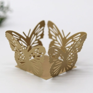 Detailed laser cut gold butterfly decorative wrap for party favor boxes and cupcakes