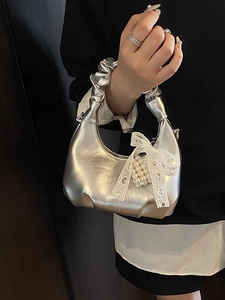 Silver metallic pleated handbag with lace bow, pearl charm and cloud handle