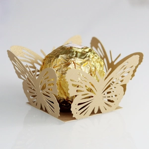 Detailed laser-cut champagne gold butterfly wrapper for chocolate party decorations