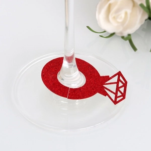 Close-up of red glitter diamond ring place card for wine glass stem decoration