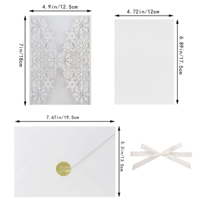 Detailed view of white laser-cut snowflake invitation set with specific dimensions