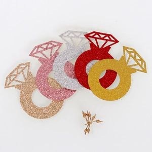 Glittering diamond ring place cards in gold, red, silver, and rose gold for party decor