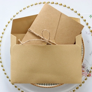 Vintage kraft paper wedding invitation envelopes with rustic hemp rope details