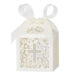 Detailed laser-cut white favor box with a cross pattern and white organza ribbon