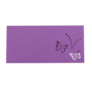 Detail of laser-cut purple kraft paper place card featuring elegant hollow butterfly patterns