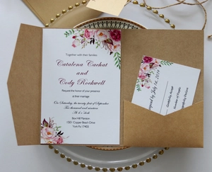 Close-up of vintage kraft paper wedding invitation set with floral watercolor card and RSVP