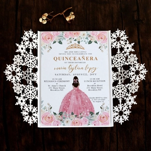 Detailed laser-cut snowflake sleeve for a pink Quinceañera invitation on wood background