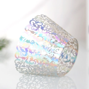 Detailed laser-cut iridescent cupcake wrapper with elegant filigree hollow patterns