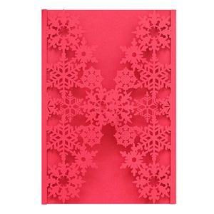 Detail view of red laser-cut snowflake greeting card made of 250g pearlescent paper