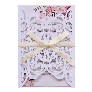 Laser-cut light blue lace wedding invitation with ribbon and floral insert card