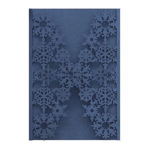 Detail of laser-cut snowflake pattern on navy blue pearlescent paper invitation card