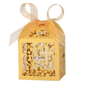 Detailed laser-cut gold candy box with cross pattern and elegant organza ribbon