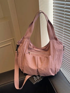 Pink nylon tote bag with large capacity and adjustable shoulder strap for daily casual use