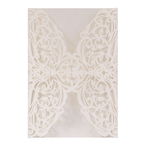 Intricate laser-cut patterns on cream white invitation card with elegant butterfly details