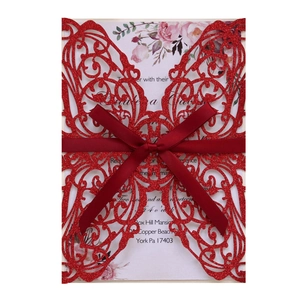 Elegant red laser cut wedding invitation with glitter finish and satin ribbon bow