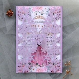 Detail of laser-cut lavender snowflake invitation for Quinceañera with floral inner card