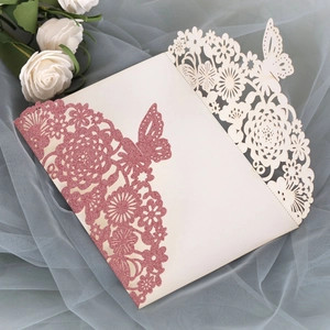 Detailed laser-cut floral invitation with rose gold glitter and butterfly accents