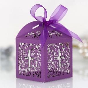Detailed laser-cut dark purple gift box featuring a cross pattern and a silk ribbon bow