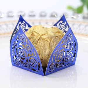 Detailed blue laser-cut rose hollow favor box holding a single golden foil chocolate