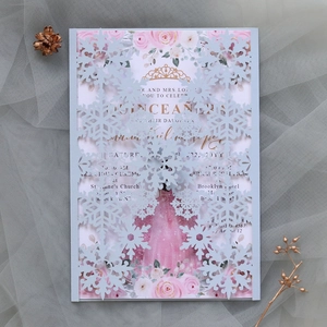 Detail of laser-cut snowflake invitation with elegant floral inner card on mesh background