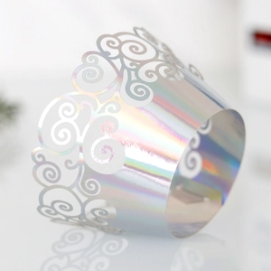 Detail showing the laser-cut hollow pattern and iridescent finish on the cupcake wrapper