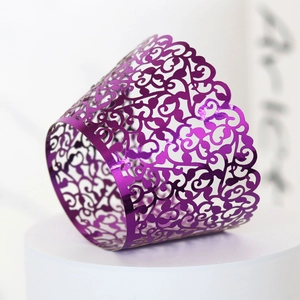 Close-up of laser-cut purple vine cupcake wrapper with mirror metallic finish for parties