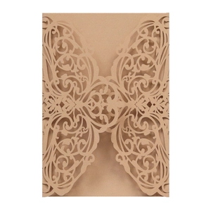 Detail of laser-cut floral pattern on vintage kraft paper wedding invitation envelope