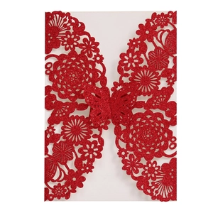 Glittery red laser-cut wedding invitation featuring rose and butterfly hollow designs