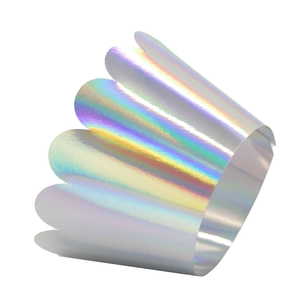 Macro view of laser hollow cupcake liners with holographic rainbow metallic finish