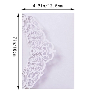 Detailed view of white laser-cut lace invitation with 4.9 x 7 inch dimension markings