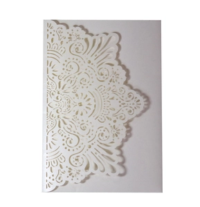 Detailed laser-cut mandala pattern on elegant white matte wedding invitation envelope