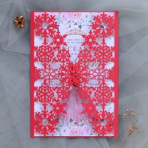Detailed laser-cut red snowflake invitation card with floral interior and elegant layout