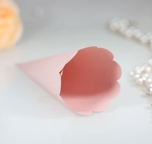Pink paper petal cone with decorative wavy edges for wedding flowers and gifts