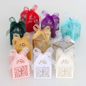 Laser cut favor boxes with cross pattern and organza ribbons in nine distinct colors