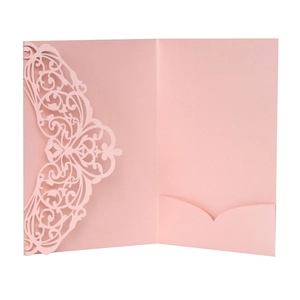 Detail of laser-cut floral pattern and inner pocket on pearlescent wedding invitation